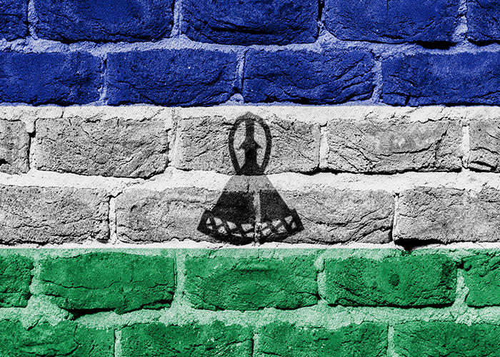 Very old brick wall with flag of Lesotho. (Shutterstock)