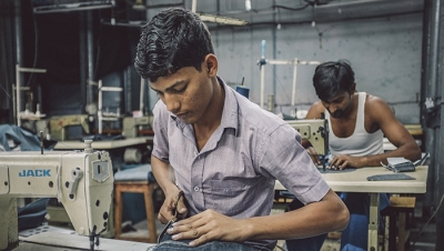 Indian workers sew in clothing factory. (iStock Photo)