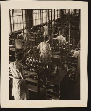 Multiple Coil Winding Machines in the plant of the Webster Electric Company. In the earlier days it was customary to wind one coil at a time. Today one girl [?] with one of these machines can wind twenty-four times as many coils as before.