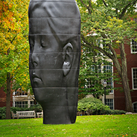 Sculpture of woman's head on the Aldrich lawn