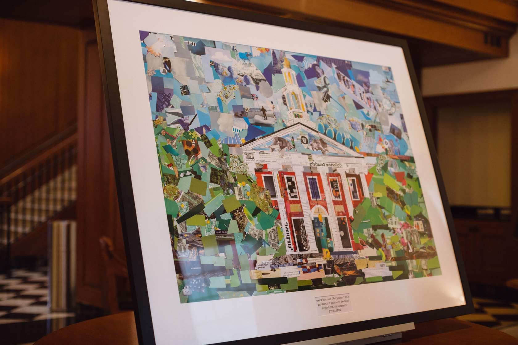 A collage of Baker Library made out of pieces of paper