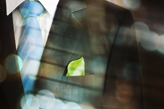 Business suit with green leaf. (Shutterstock)