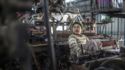 Woman in a small silk factory. (Shutterstock)