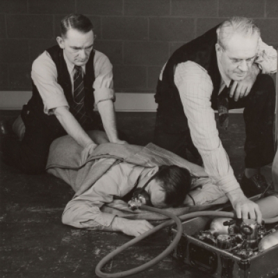 Close-up of practicing proper method of resuscitation--Gary Works