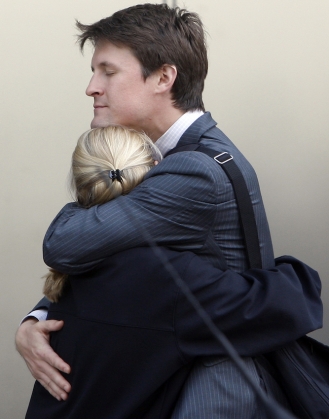 Workers embrace outside the offices of Lehman Brothers in Canary Wharf in London, Monday, September 15, 2008. Courtesy of AP Photo/Kirsty Wigglesworth.